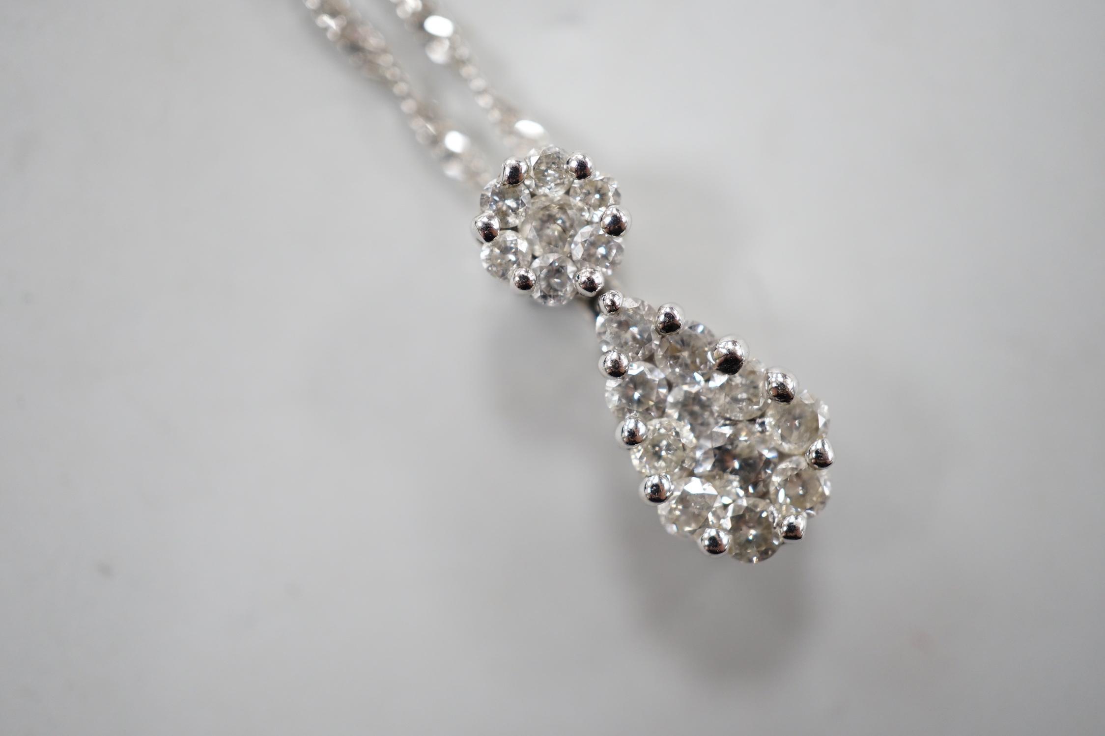 A modern 14kt white metal and pave set diamond set pear shaped pendant necklace, 52cm, gross weight 4.2 grams.